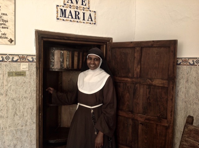 Sor María in front of the 'lazy Susan' where good can be bought from the cloistered nuns. Photo © snobb.net